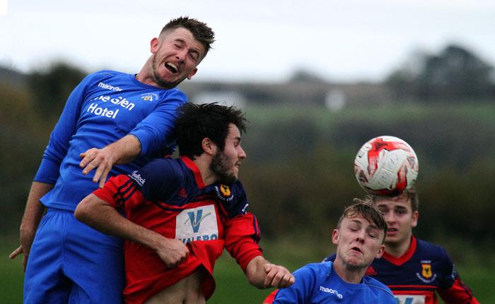 Merlins Bridges Luke Hayward beats Carews James Hinchliffe to this header